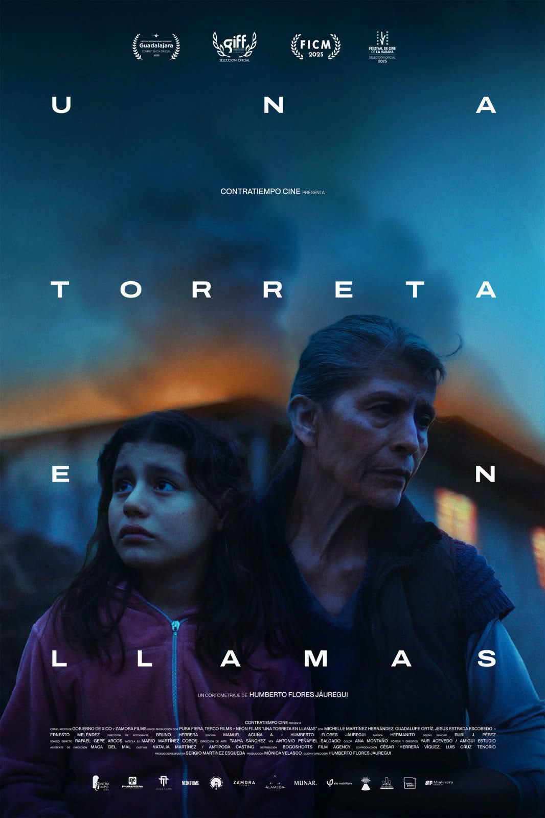 ‘una torreta en llamas’: el cortometraje nominado al ariel 2026 grabado en xico, veracruz la revista del sureste mx Póster Oficial Del Cortometraje &Quot;Una Torreta En Llamas&Quot;, Dirigido Por Humberto Flores Jáuregui. En El Centro Destacan Los Rostros De Perfil De Una Mujer Adulta Mayor Y Una Niña, Iluminadas Con Tonos Fríos En Azul Y Morado. En La Parte Superior Figuran Laureles De Festivales De Cine Como Ficg, Giff Y Ficm. El Título Del Cortometraje Aparece Distribuido En Letras Blancas Separadas Sobre La Imagen Nocturna.